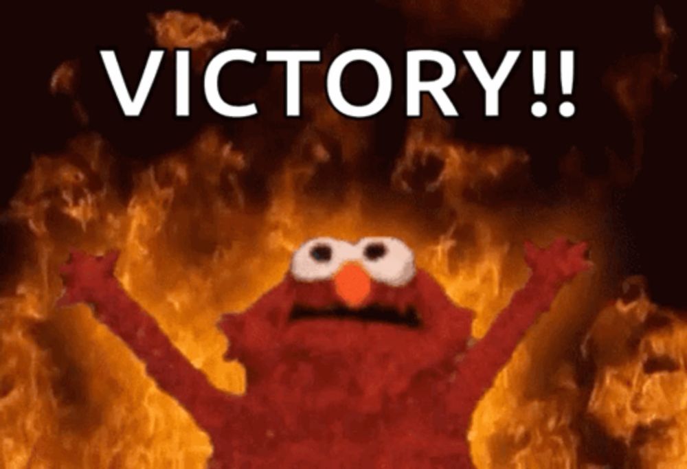 elmo is surrounded by flames and the word victory is written above him