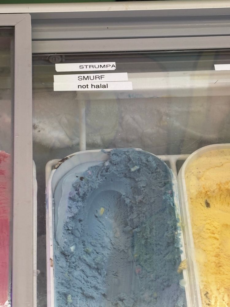 Blue ice cream in an ice cream shop in Selfoss, south Iceland. It reads « Smurf (not halal) »