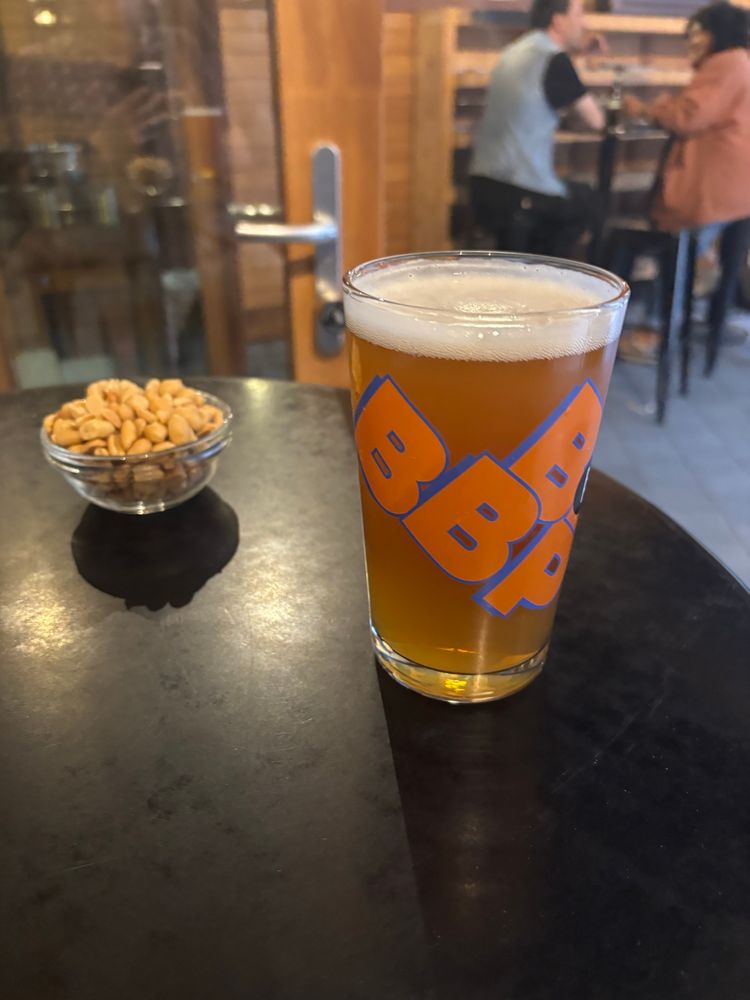A pintje of Delta IPA on a table at Au Bassin in Ste Catherine, Brussels. Also, free peanuts!