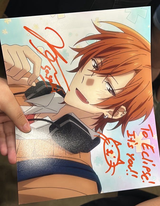 A print out photo of Sasaki from the anime Sasaki to Miyano signed by the English voice actor Kellen Goff: “To Eclipse: “Its you!!”” 
