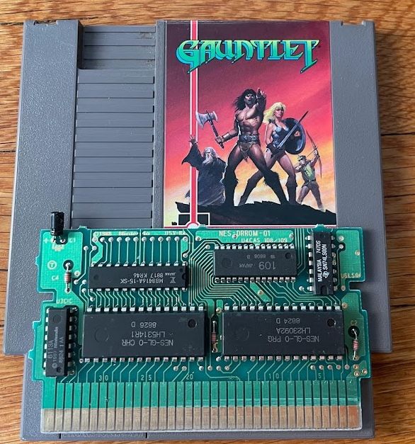 A photo of the licensed Tengen NES release of Gauntlet with the cartridge PCB taken. On the top right of the PCB, there's a chip that says "109 Japan" on it.
Photo credit: @nicole.express‬
https://nicole.express/2022/the-center-point-can-not-hold.html