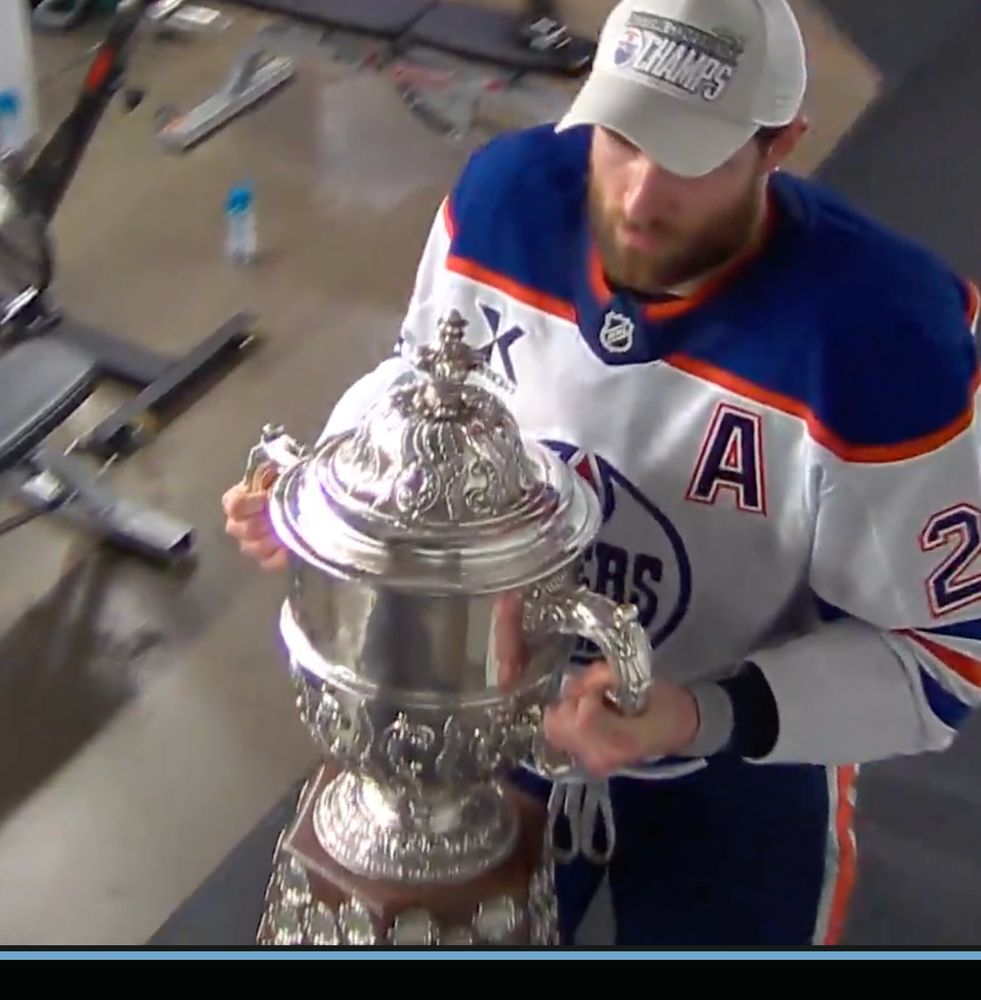 Leon Draisaitl taking the Clarence Campbell Bowl back to the Oilers' locker room.