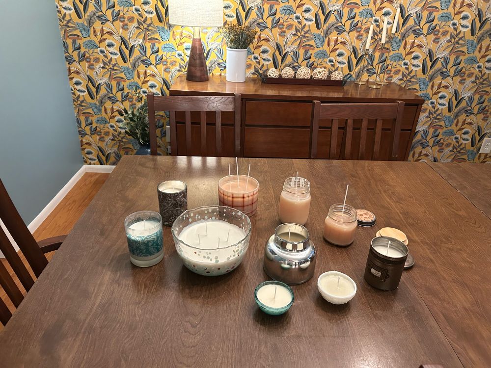 A variety of candles on a table. 