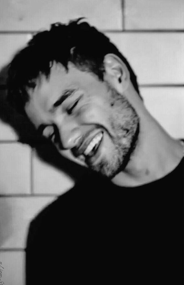 Black and white picture of Liam smiling 