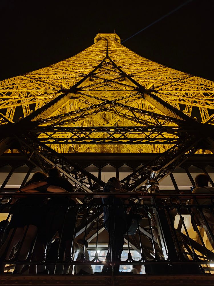 looking up the eiffel tower from the 2nd stage platform
