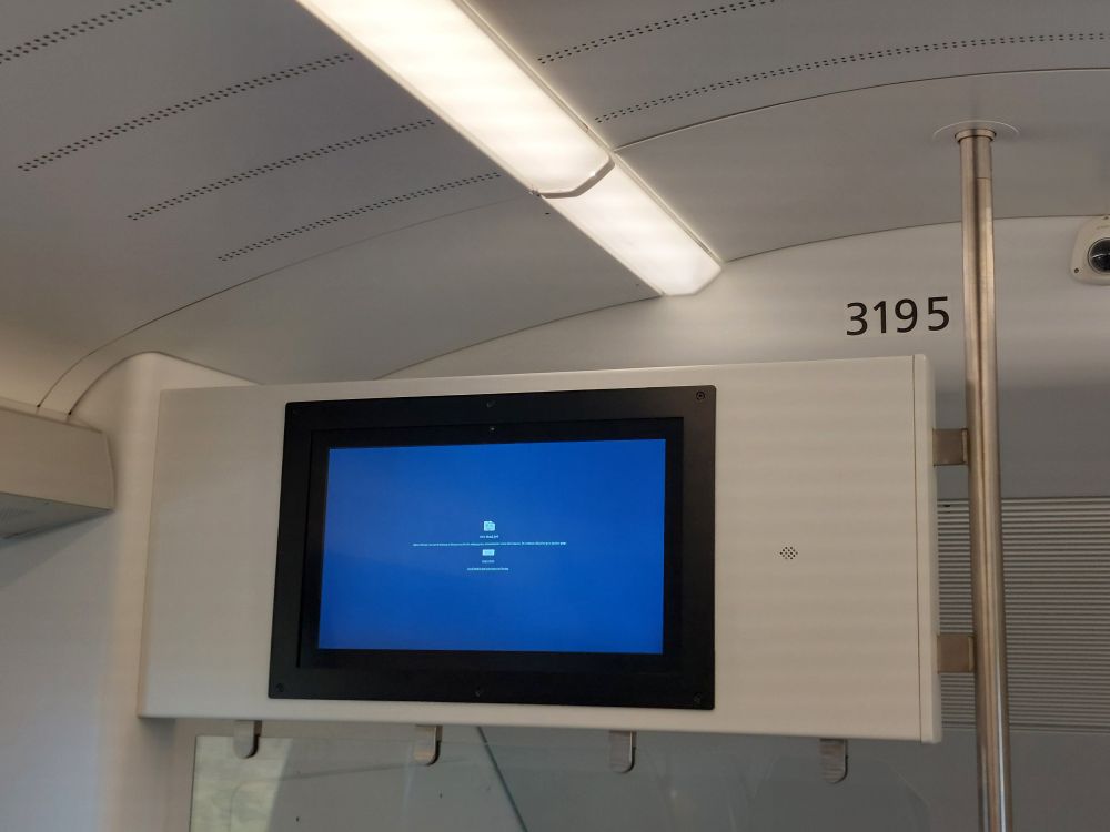A screen in Caltrain showing a Chrome screen of death