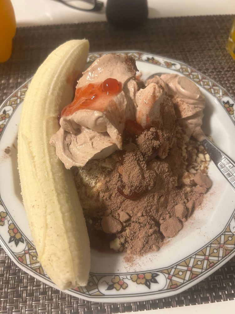A bowl with ice cream, banana, chocolate powder, strawberry jam, chocolate cream and almond pieces

Calories: who cares?
Time to eat: 10 minutes, max
Time to prepare: 10 minutes including whipping the cream and mincing the almonds and not least washing up and cleaning