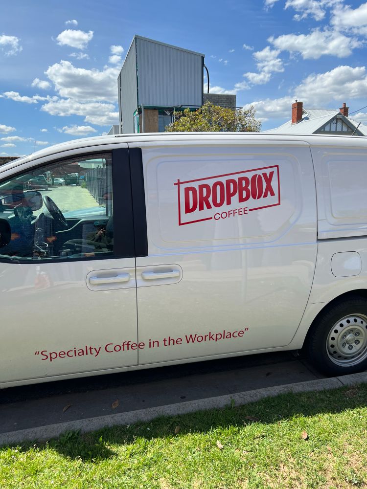 A van with ‘Dropbox Coffee’ written on the side 