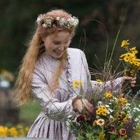 Beth March (Little Women), arranging flowers and wearing a flower crown and generally being pure and doomed.