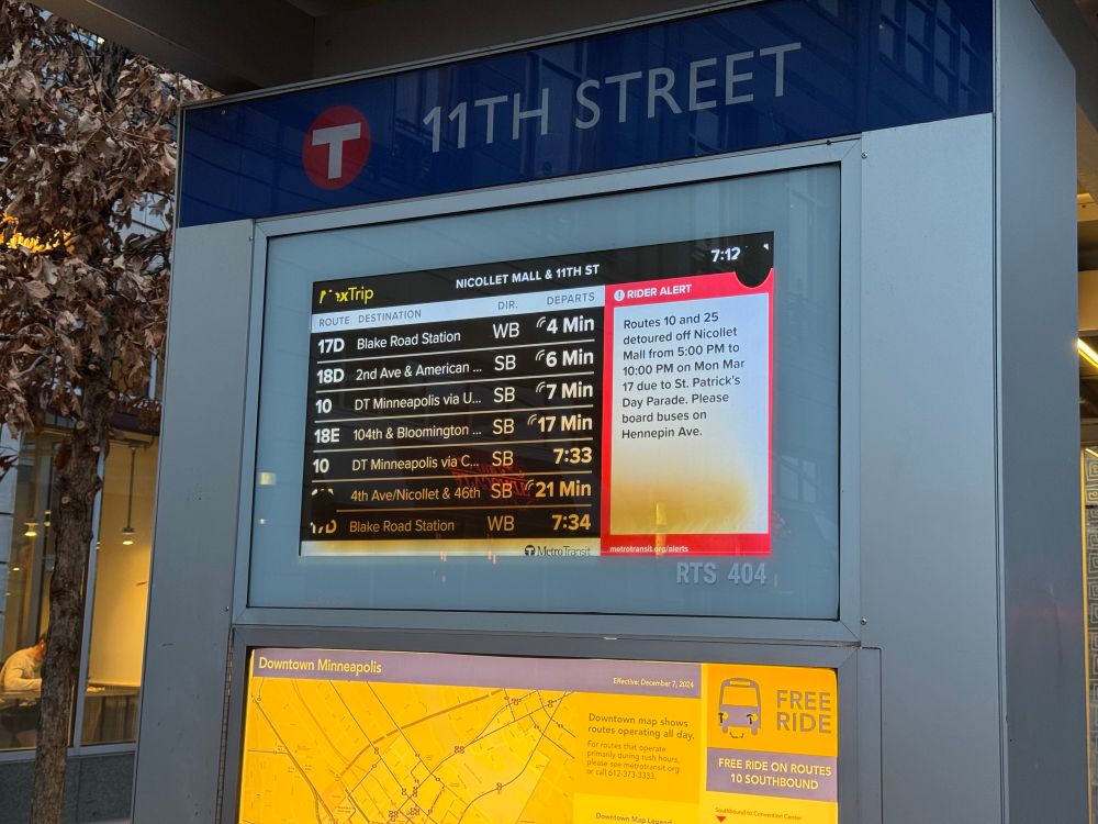 Picture of a nextrip display showing departure times on left and alerts on right