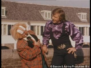 A clown and an acrobat are joking around in the old town of Naarden, the Netherlands.