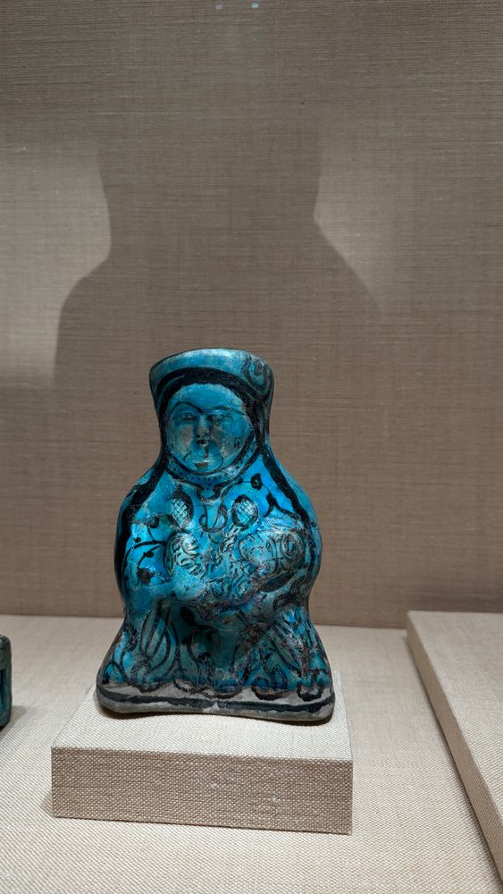 Persian figurine of a breastfeeding woman and her baby