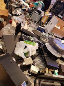 An assortment of old electronics on a table.