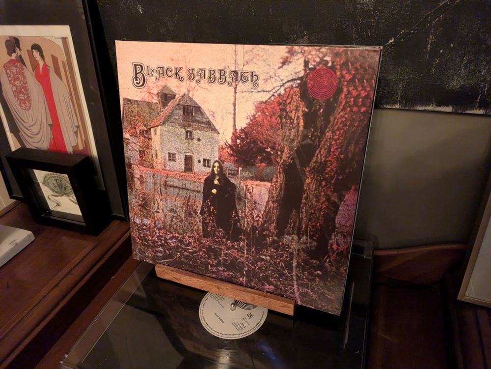 The album cover for Black Sabbath's debut album, sitting atop a record player.