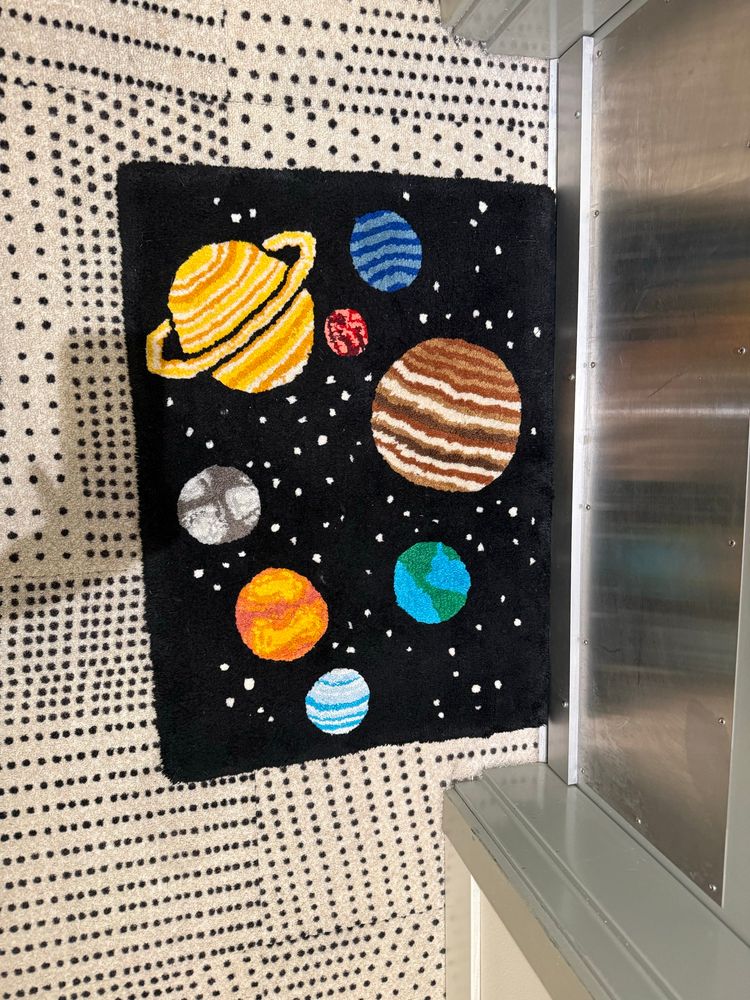 A picture of a cool galaxy mat!