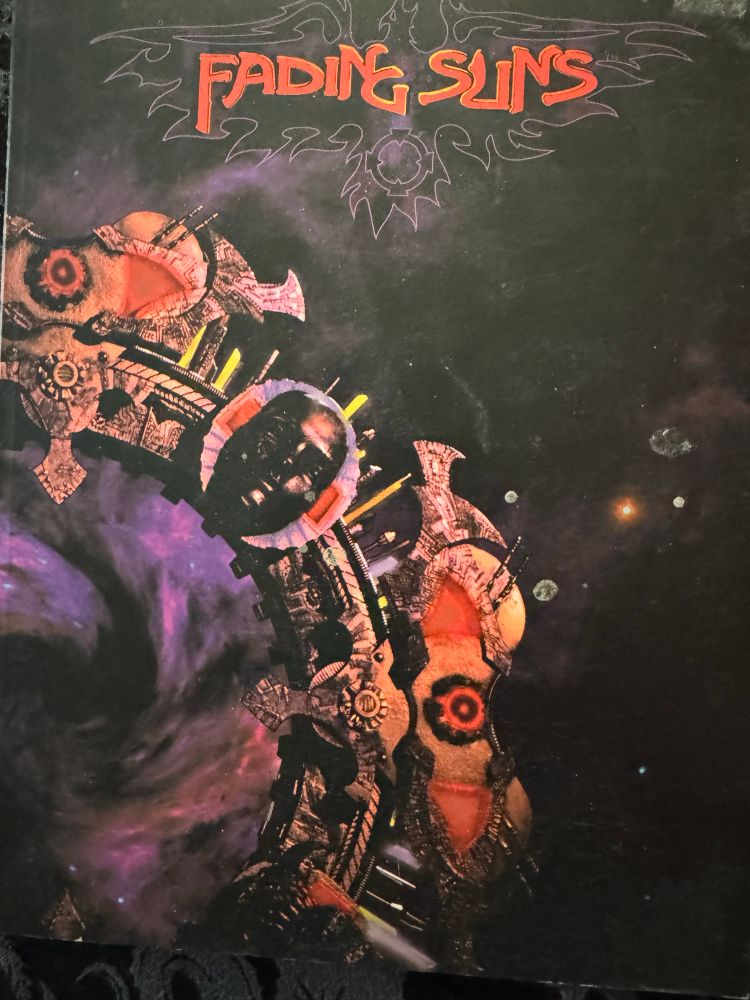Fading Suns ttrpg main rulebook
Weird stargate with a face carved on it 