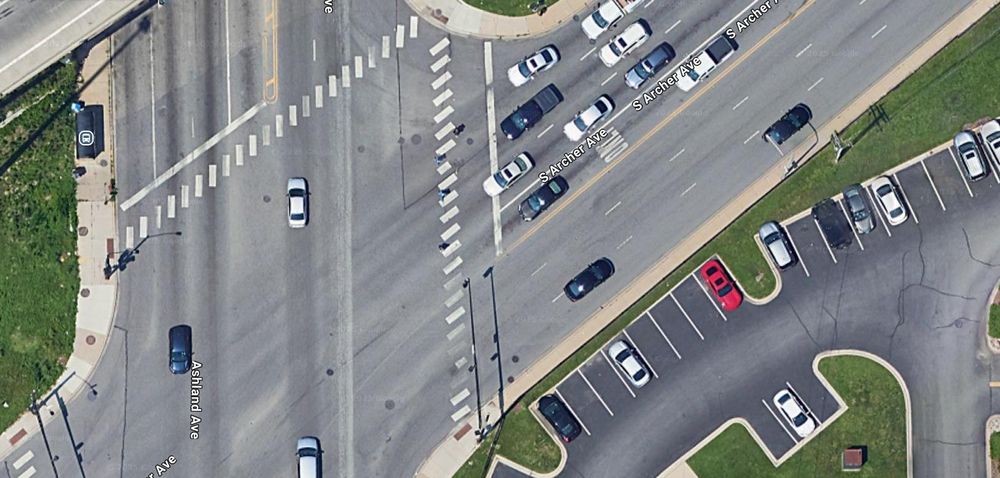 An aerial intersection image from Google maps. Ashland Ave. is 6 lanes wide. Archer Avenue is 7 lanes wide. 