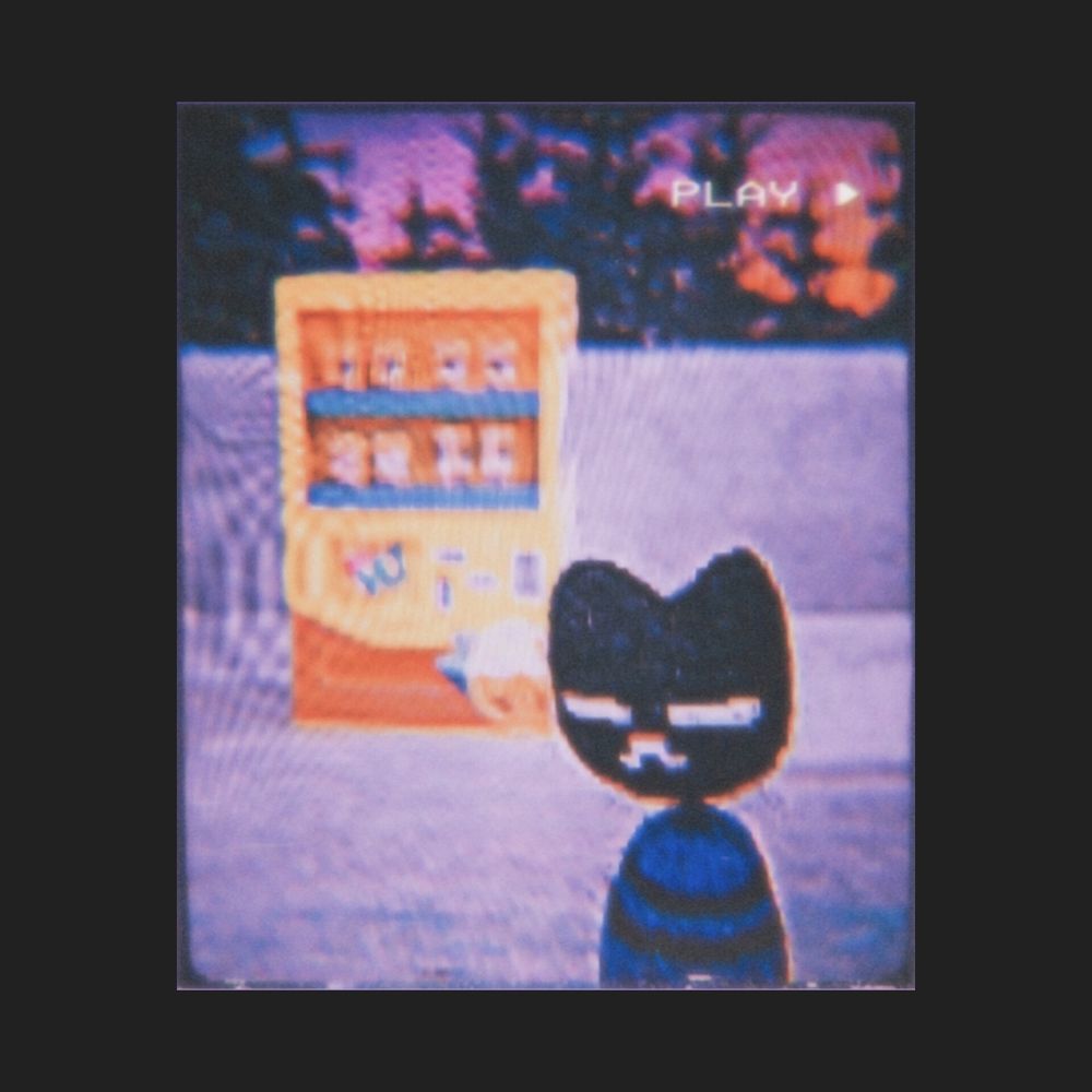 Image shows a low-res edit of the Easy Delivery Co. cat in front of a toy vending machine. Behind them is a print of pine trees below a dark pink and orange sky. The cat has black fur and is wearing a blue and black striped sweater.