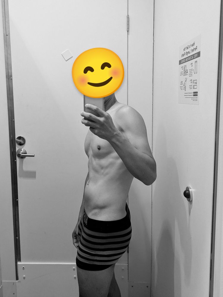 Photo of self in a fitting room mirror, wearing underwear. B&W