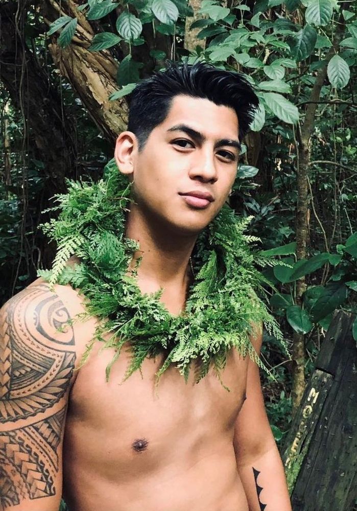 Actor Kaipo Dudoit wearing a garland