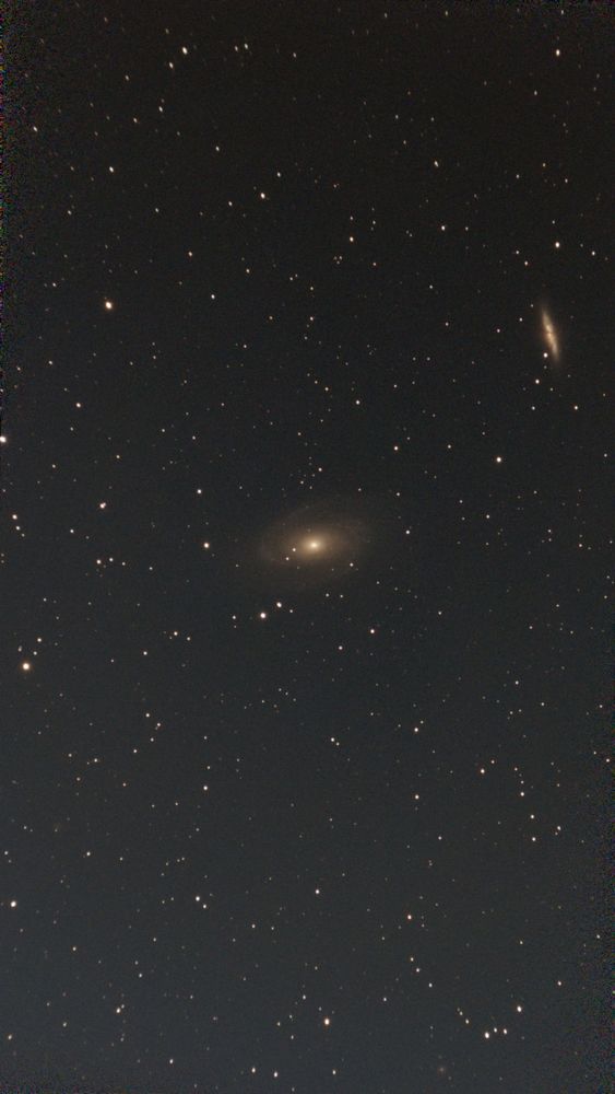 Two galaxies, the bode and cigar in a field of stars 
