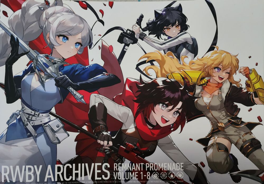 A photo taken by me of my copy of the RWBY artbook "RWBY Archives: Remnant Promenade Volume 1-8". The cover art, left to right, is of Weiss, Ruby, Blake, and Yang in their Atlas outfits.