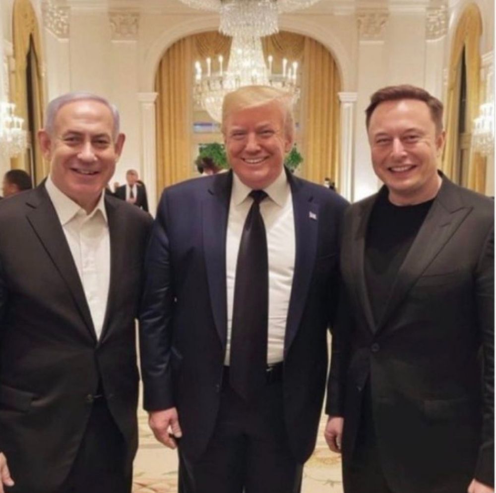 A picture of Trump, musk and some other dillweed. 