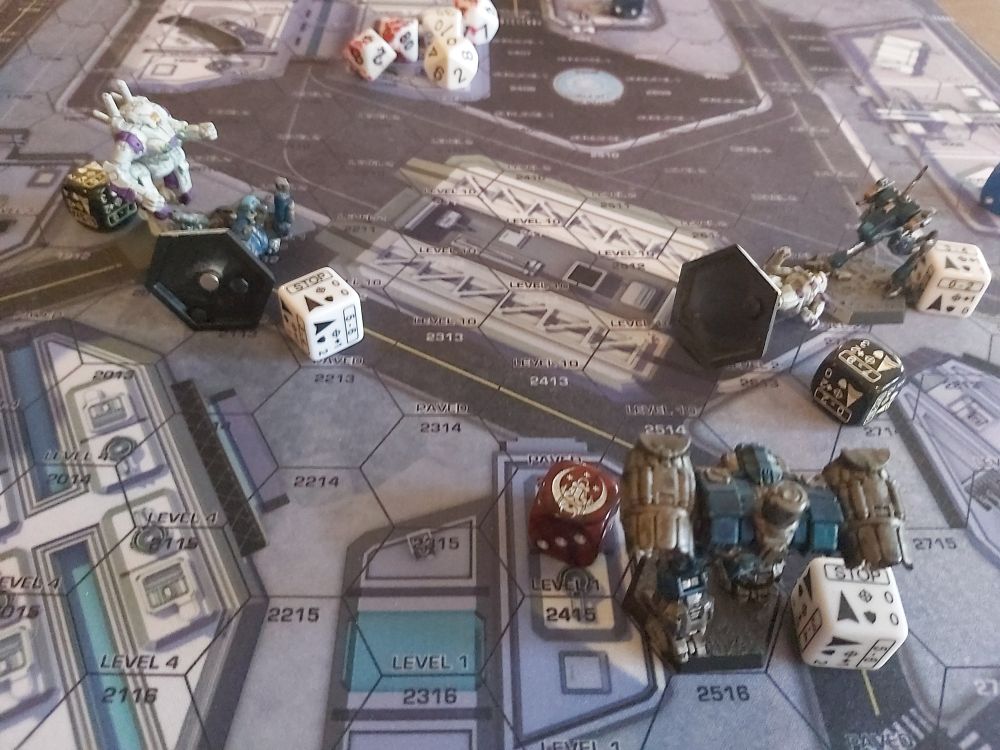 The Aftermath of the combat, a Merc Longbow stand ready, with a prone FWG spider with a Merc Locust standing over it, FWG Ostsol standing over a Chameleon