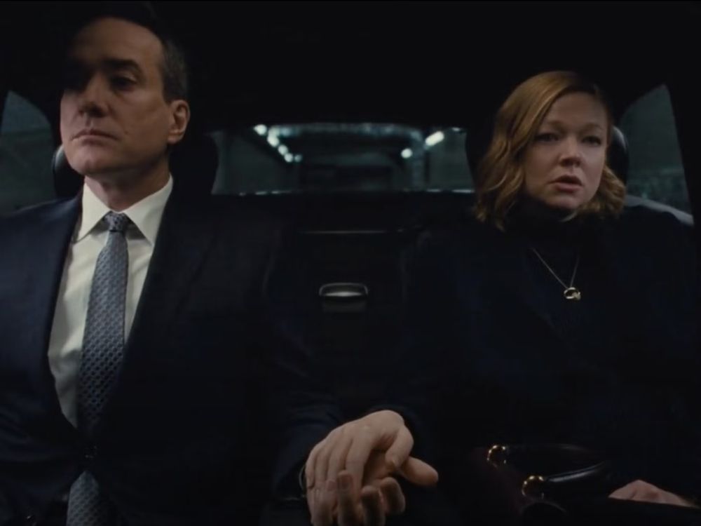 Still from Succession finale. Shiv and Tom sitting in the back of the car, almost holding hands