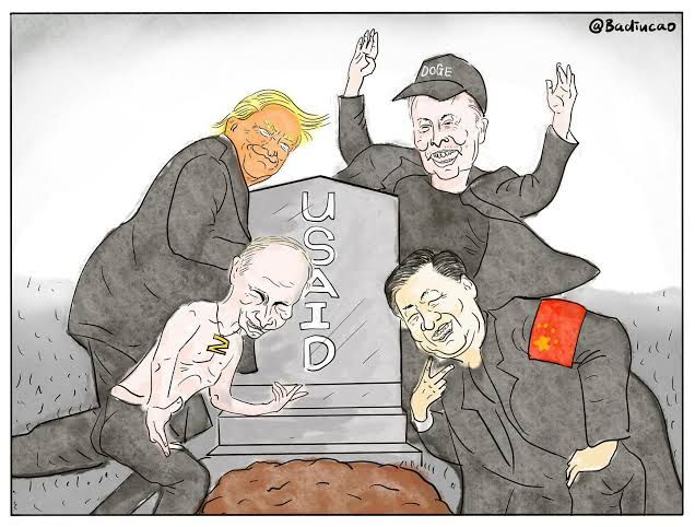 A political cartoon depicts four prominent world figures celebrating around a gravestone marked “USAID.” Former U.S. President Donald Trump grins while leaning over the tombstone. Elon Musk, wearing a “DOGE” hat, raises his hands in mock celebration. Vladimir Putin appears shirtless, smirking as he scratches the tombstone. Chinese President Xi Jinping, wearing a red armband with the Chinese flag, laughs sinisterly with a hand on his chin. A fresh grave lies open at the foot of the tombstone, symbolizing the burial of the U.S. Agency for International Development (USAID). The overall tone is critical and satirical.