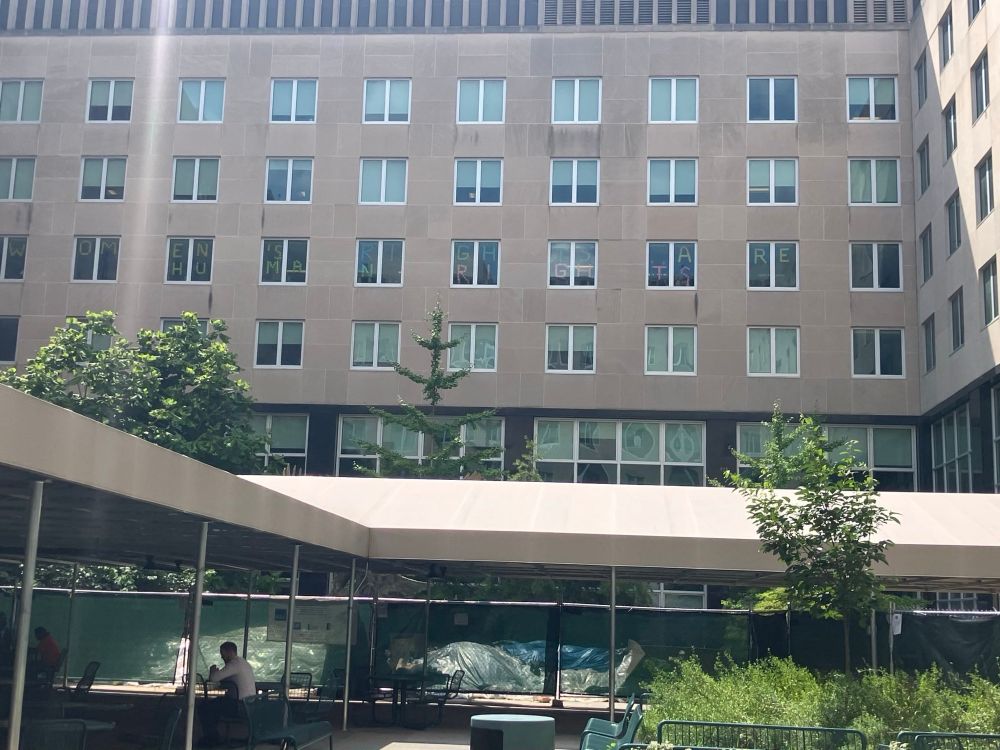 Spelled on the windows of the State Department, “Women’s Rights are Human Rights”. Dated July 11th, 2025 