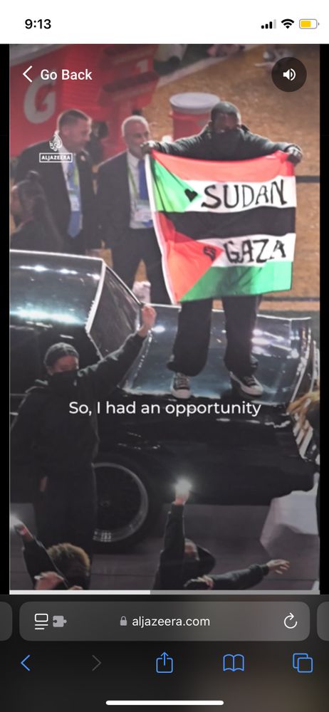 
ALAZEERA screenshot
Man with SUDAN & Palestine flags 
“So, I had an opportunity”
