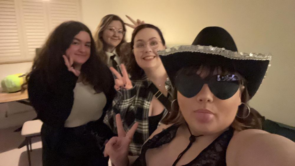 4 cool gals with a variety of black and white outfits