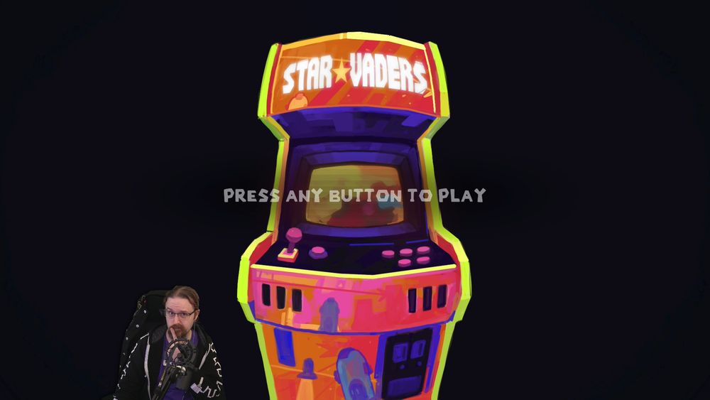 Will, a streamer with purple hair, glasses, and a black hoodie, looks curiously at the start screen for Star Vaders. The screen is designed to look like a classic arcade cabinet labeled Star Vaders with the text "Press any button to play" superimposed above.