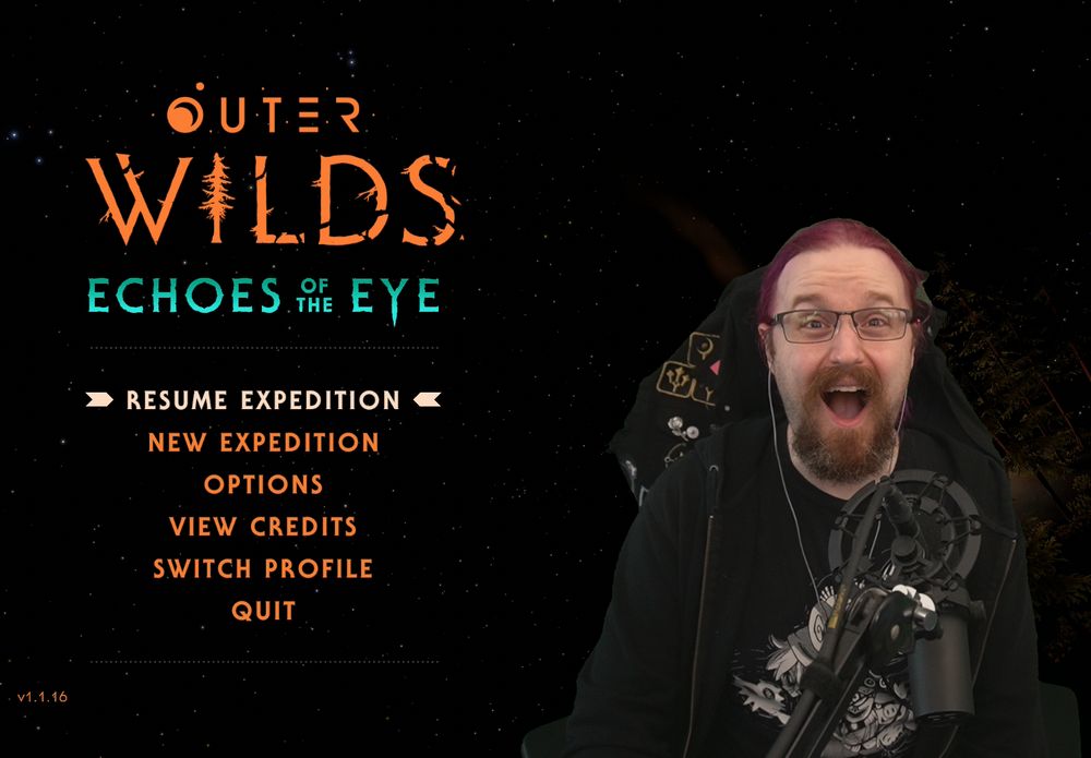 Will, a streamer in a hoodie with purple hair and glasses, sits next to the starting menu for Outer Wilds. 