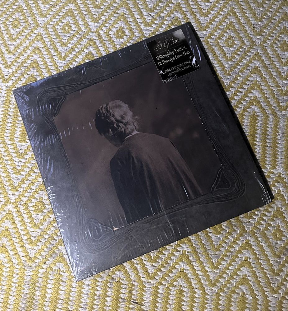 Cover of the LP Willoughby Trucker, I'll Always Love You by Ethel Cain.  A sepia-toned image of a young man from behind.