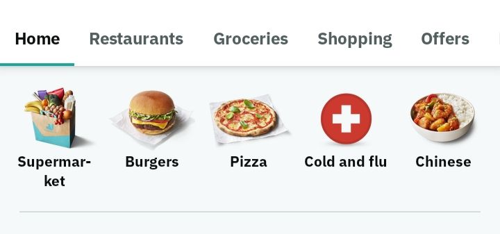 The home screen of an app (in this case, Deliveroo) with choices, together with appropriate icons, for:
Supermarket (shopping bag)
Burgers (a burger in a bun)
Pizza (a margherita pizza with a bit of basil on top too, looks nice)
Cold and flu (a white cross in a red circle, to suggest first aid)
Chinese (a bowl half filled with rice and half filled with a battered something looking really tasty) 