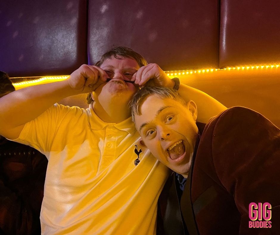 Gig Buddies at a karaoke social being silly together. 