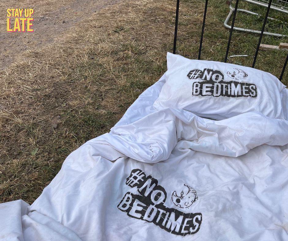 A bed that has "#No  Bedtime" spray painted on it.