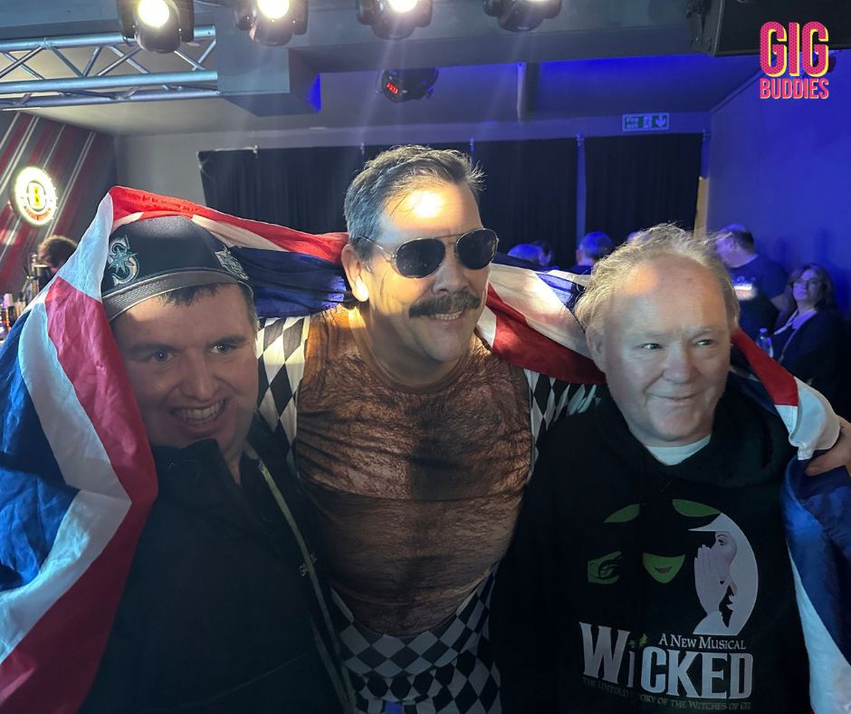 Two gig buddies with Fat Freddie from the tribute band.