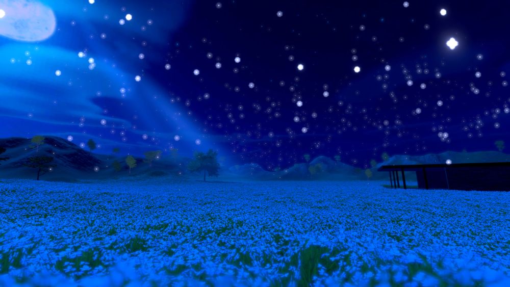 A tree stands in the middle of a field of blue flowers, a beam of moonlight shines from behind the tree. A beautiful starry night sky can be seen overhead. The picture has been taken from out in the field of blue flowers showing the building the tree and the moon shining down.
