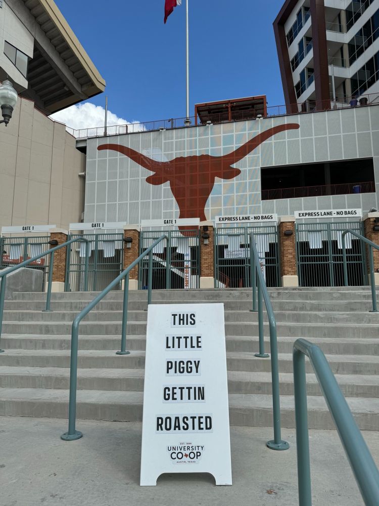White sign that says this little piggy gettin roasted