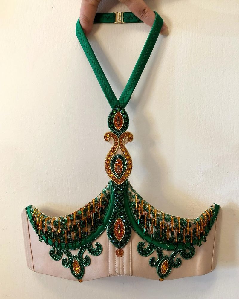 A bra modeled to look like twin birdcages, with the cage domes removed.