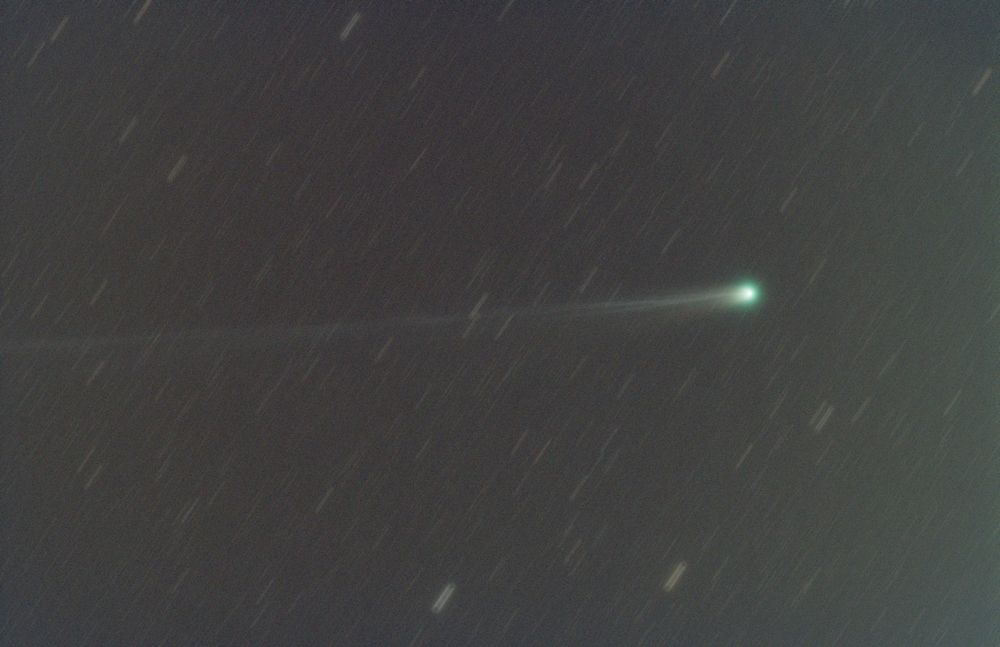Comet A6 Lemmon stacked with star trails background. 
