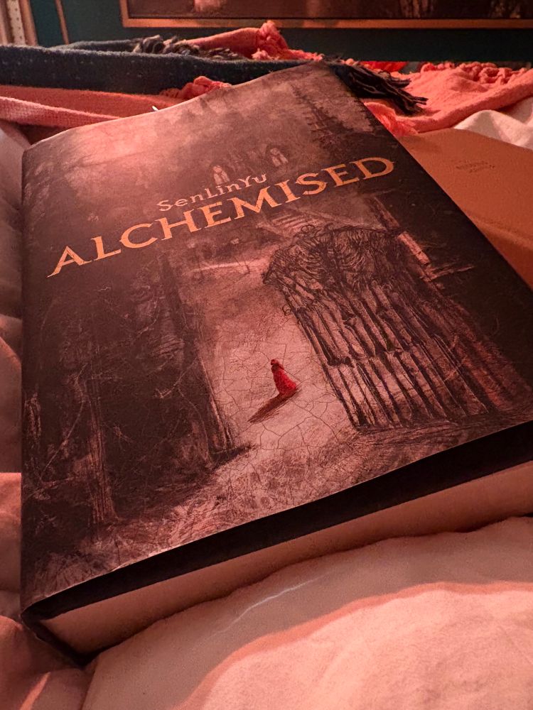 Photo of a hardcover copy of “Alchemised”  by SenLinYu