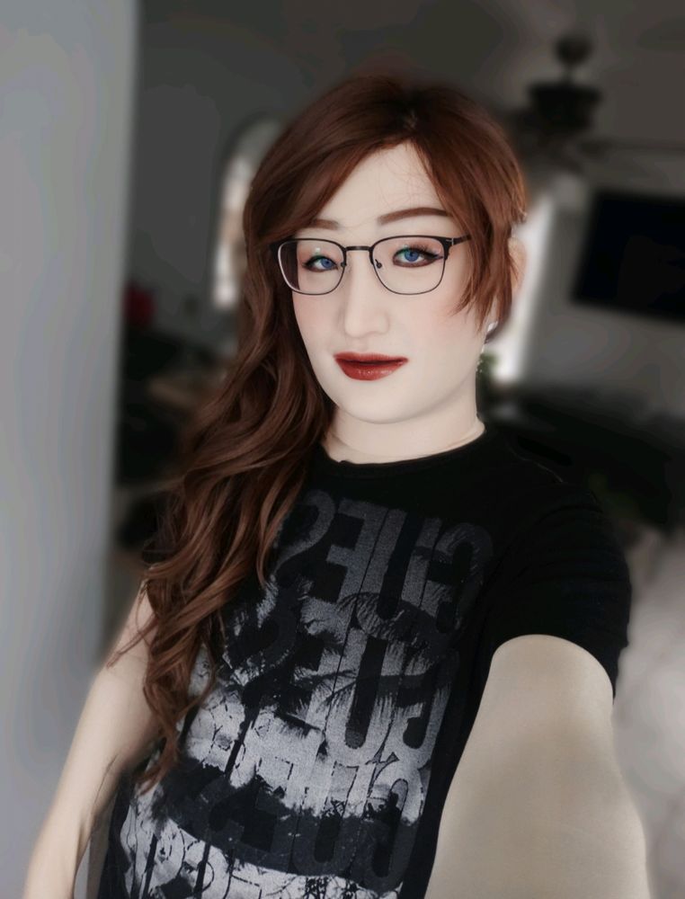 A photo of me in my silicone mask and bodysuit 