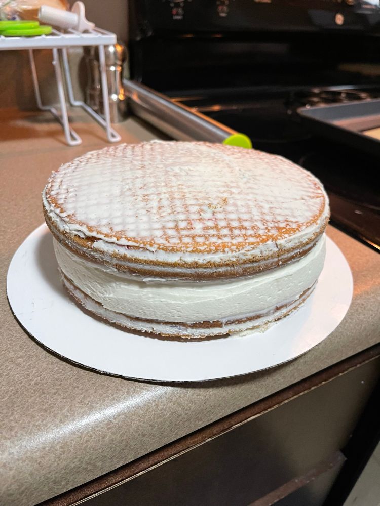 Funfetti cake with buttercream icing crumb coat. 