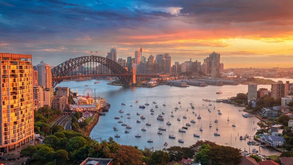 sydney harbour with the bridge at sunrise (i think)