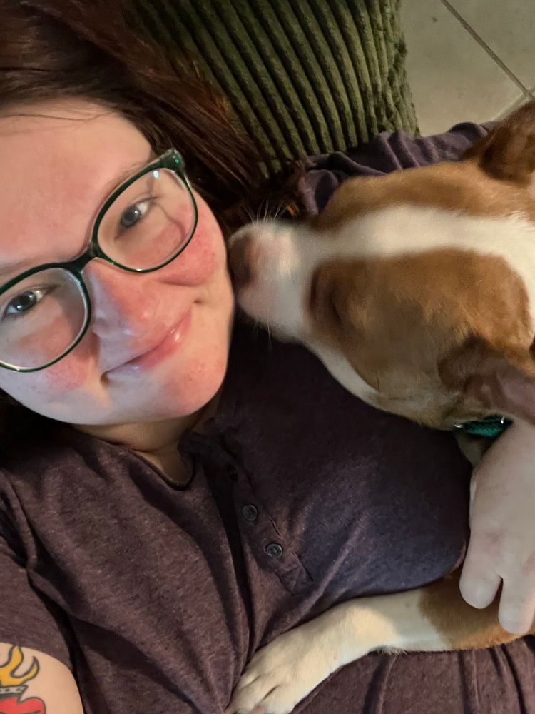 A blurry Betty licking Sydney’s face 