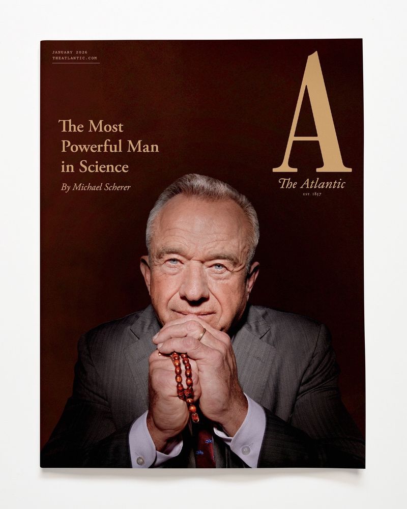 RFK Jr on the cover of The Atlantic, smiling and holding a rosary. The featured article about him is entitled "The Most Powerful Man In Science."